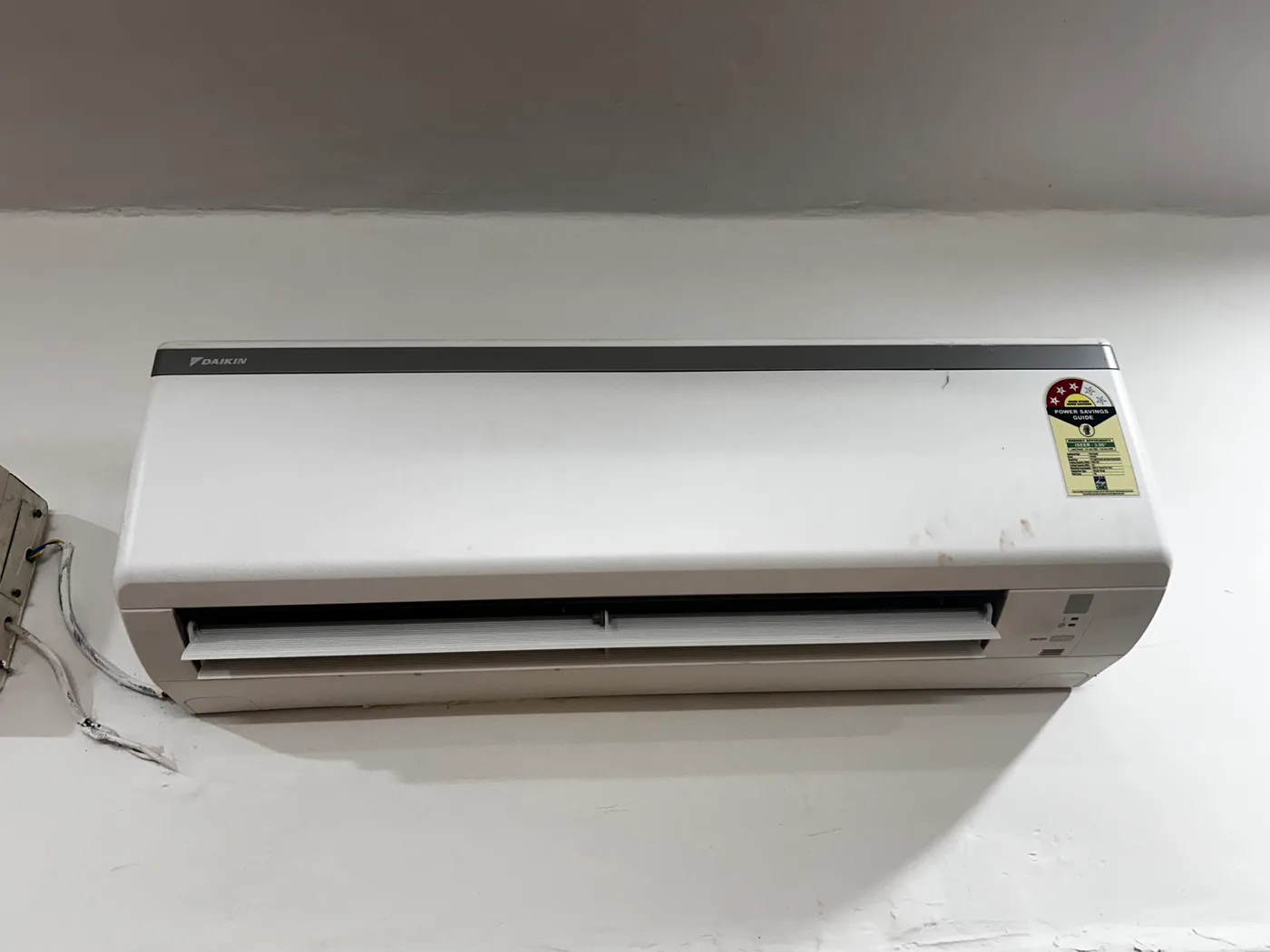 Daikin split AC unit installed in room at Duhomes boys PG Kamla Nagar