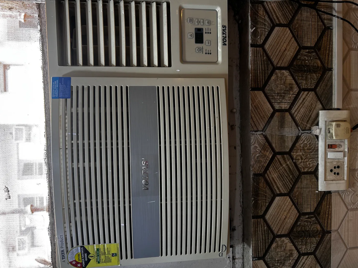 Voltas window AC unit in room at Duhomes boys PG Kamla Nagar